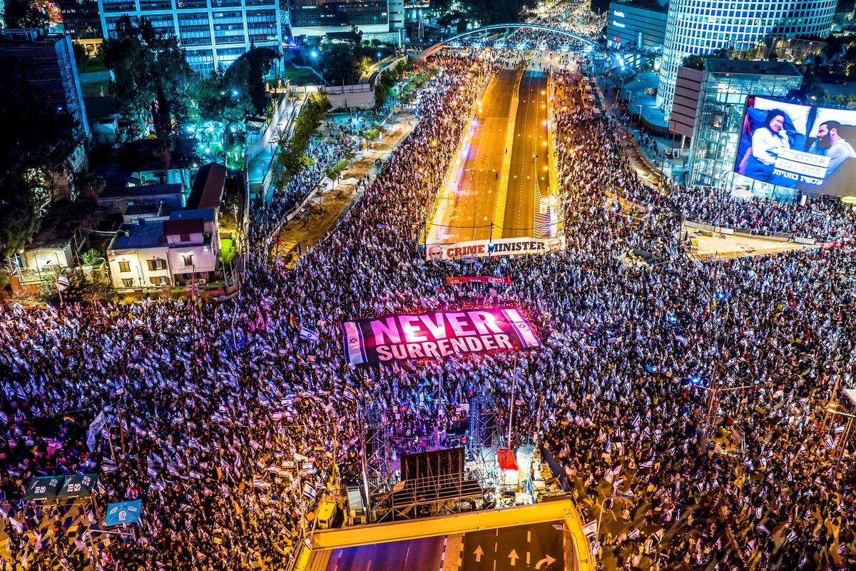 An aerial view shows people protesting as Israeli Prime Minister Benjamin Netanyahu’s nationalist coalition government presses on with its contentious judicial overhaul, in Tel Aviv, Israel, March 18, 2023. 