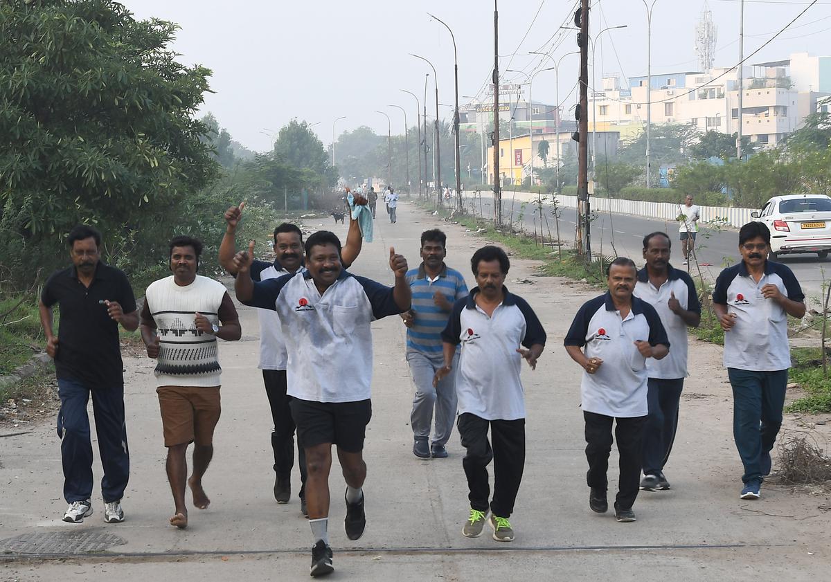 People walking and jogging in the early morning  at Velachery.