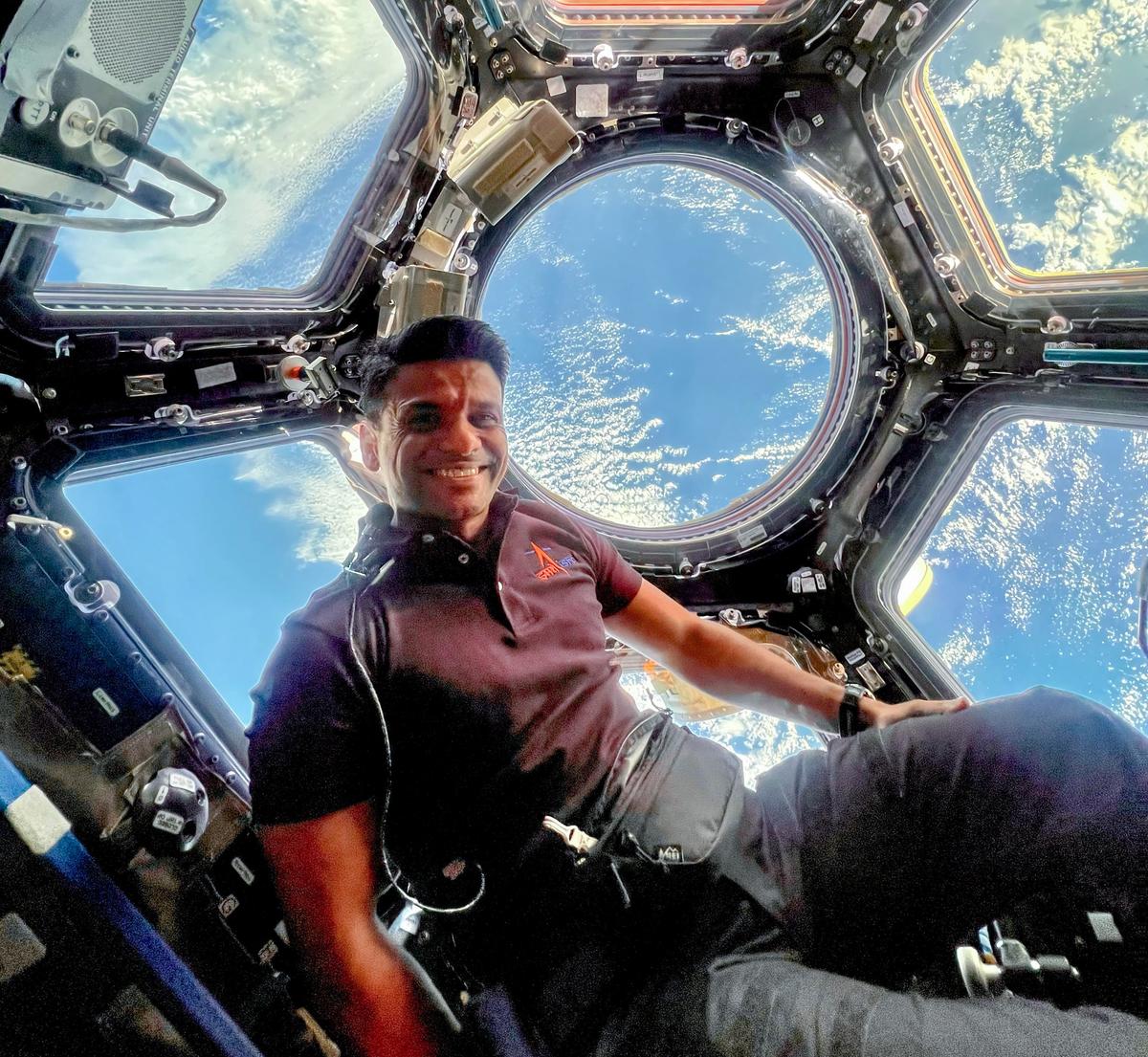 Group Captain Shubhanshu Shukla enjoys a panoramic view of the Earth from the seven-windowed Cupola Module of the International Space Station. Source: X/@ISROSpaceflight