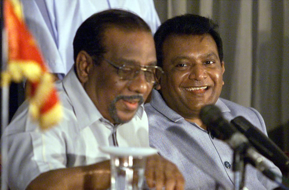 Prabhakaran with Anton Balasingham (left).
