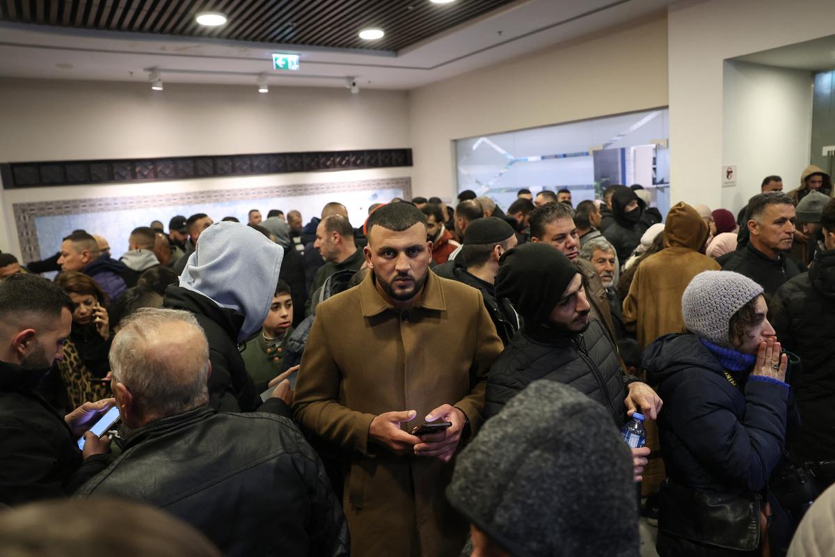 Palestinian families react after Israel delayed the release of Palestinian prisoners, scheduled to be released in the seventh hostage-prisoner exchange, in the occupied West Bank city of Ramallah early on February 23, 2025. 