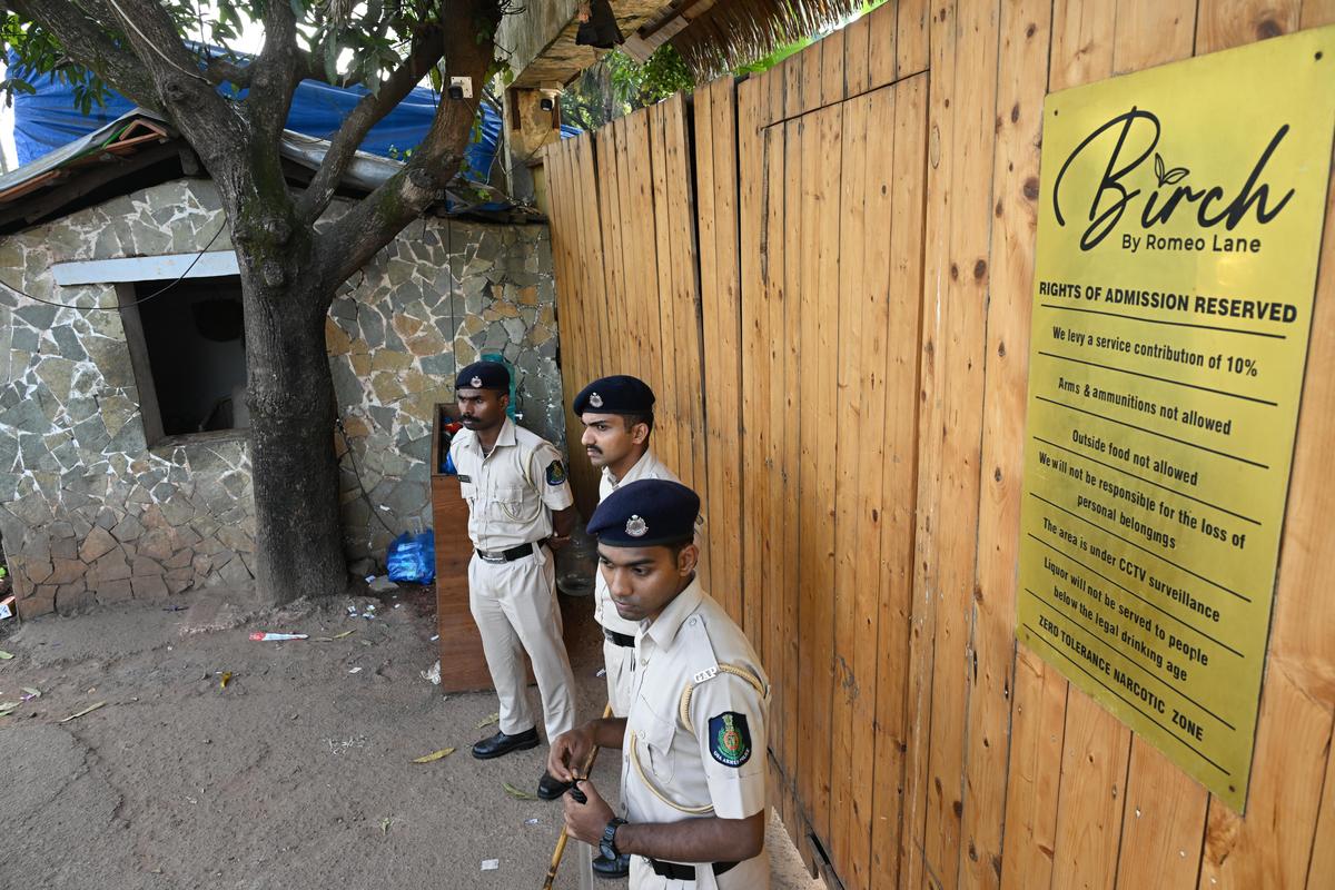 Policemen stand guard outside Birch by Romeo Lane nightclub at Arpora in North Goa, on December 08, 2025.