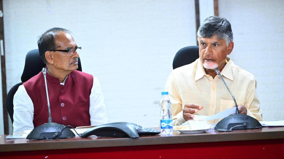 Union Minister Shivraj Singh Chouhan and Chief Minister N. Chandrababu Naidu participating in a review meeting on the flood situation, at the Collectorate in Vijayawada on Thursday.