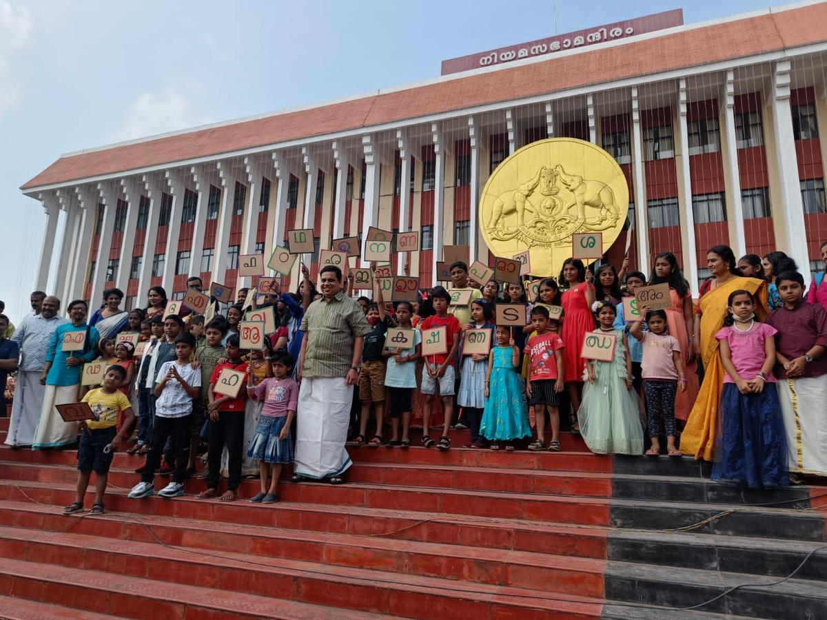 Students of Malayalam Pallikkodam with Chairman AN Shamseer during the Kerala Legislature International Book Festival
