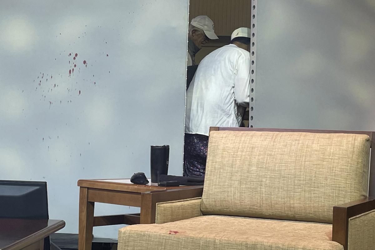 Blood stains mark a screen as author Salman Rushdie, behind screen, is tended to after he was attacked during a lecture on August 12, 2022, at the Chautauqua Institution in Chautauqua, New York about 120 km south of Buffalo. Blood stains mark a screen as author Salman Rushdie, behind screen, is tended to after he was attacked during a lecture on August 12, 2022, at the Chautauqua Institution in Chautauqua, New York about 120 km south of Buffalo.