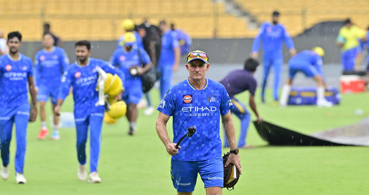 CSK’s batting coach Michael Hussey walks back after rain interrupts a training session ahead of the IPL 2025 match between Royal Challengers Bengaluru and Chennai Super Kings, at the M. Chinnaswamy Stadium, in Bengaluru on May 02, 2025.
