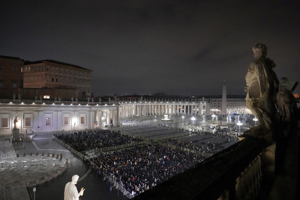 People attend a rosary prayer service held for the health of Pope Francis in St Peter's Square at The Vatican, Monday, Feb. 24, 2025. (AP Photo/Kirsty Wigglesworth)