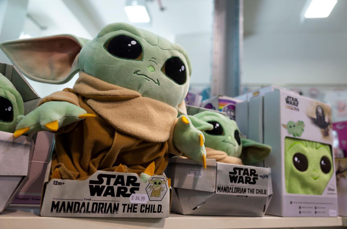 Baby Yoda, a popular character from the 'The Mandalorian' spin-off branch of the 'Star Wars' franchise, merchandise for sale at a store in Leeds, United Kingdom. 