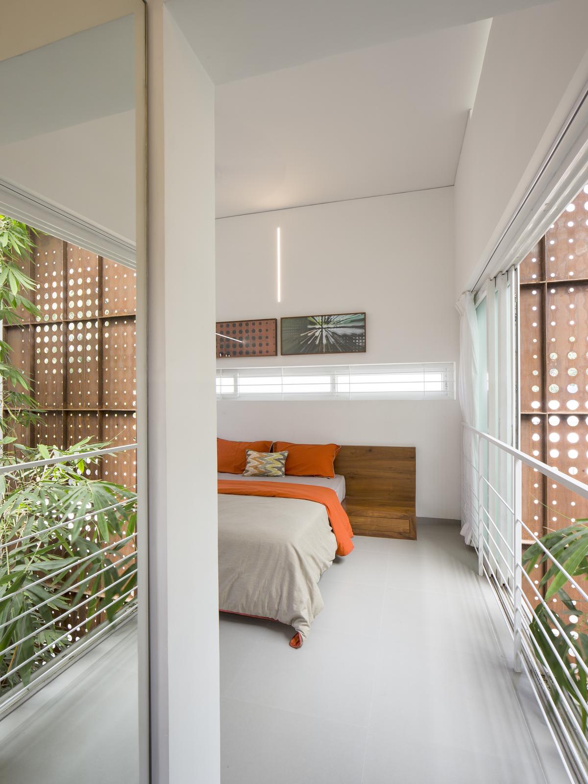 The Breathing Wall Residence: a bedroom on the second floor.