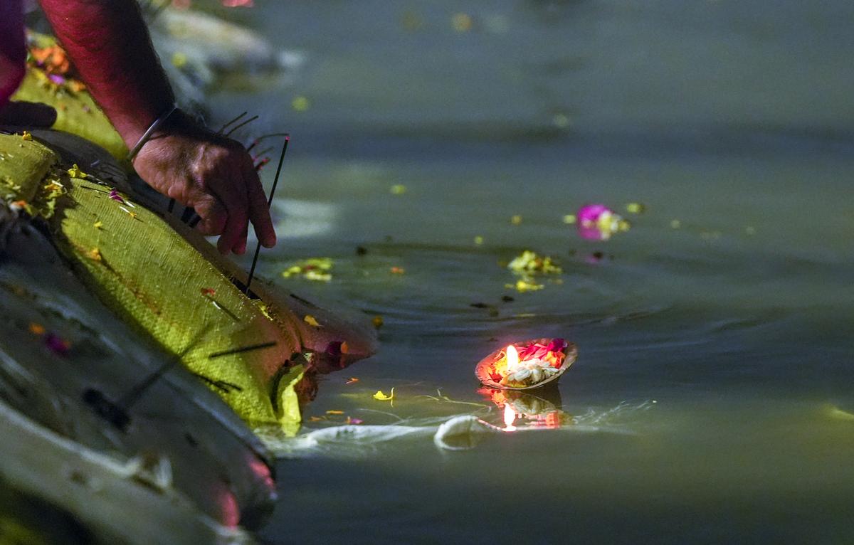A devotee performs rituals on the bank of the Ganga during the Maha Kumbh Mela on January 31, 2025. A devotee performs rituals on the bank of the Ganga during the Maha Kumbh Mela on January 31, 2025.