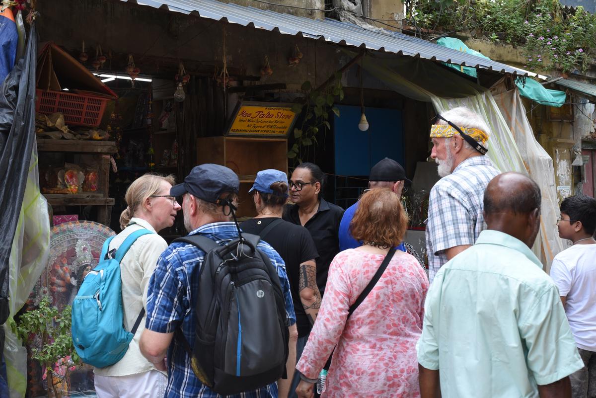 A busy street in the narrow lanes of Kumartuli. 