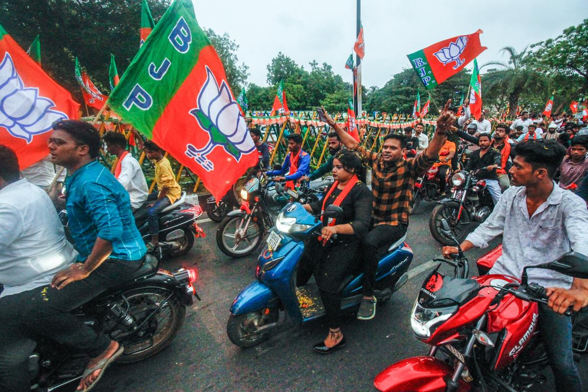 BJP supporters celebrate in Bhubaneswar on June 11, 2024, after Defence Minister Rajnath Singh announced that BJP MLA Mohan Charan Majhi would be the new Chief Minister of Odisha. 