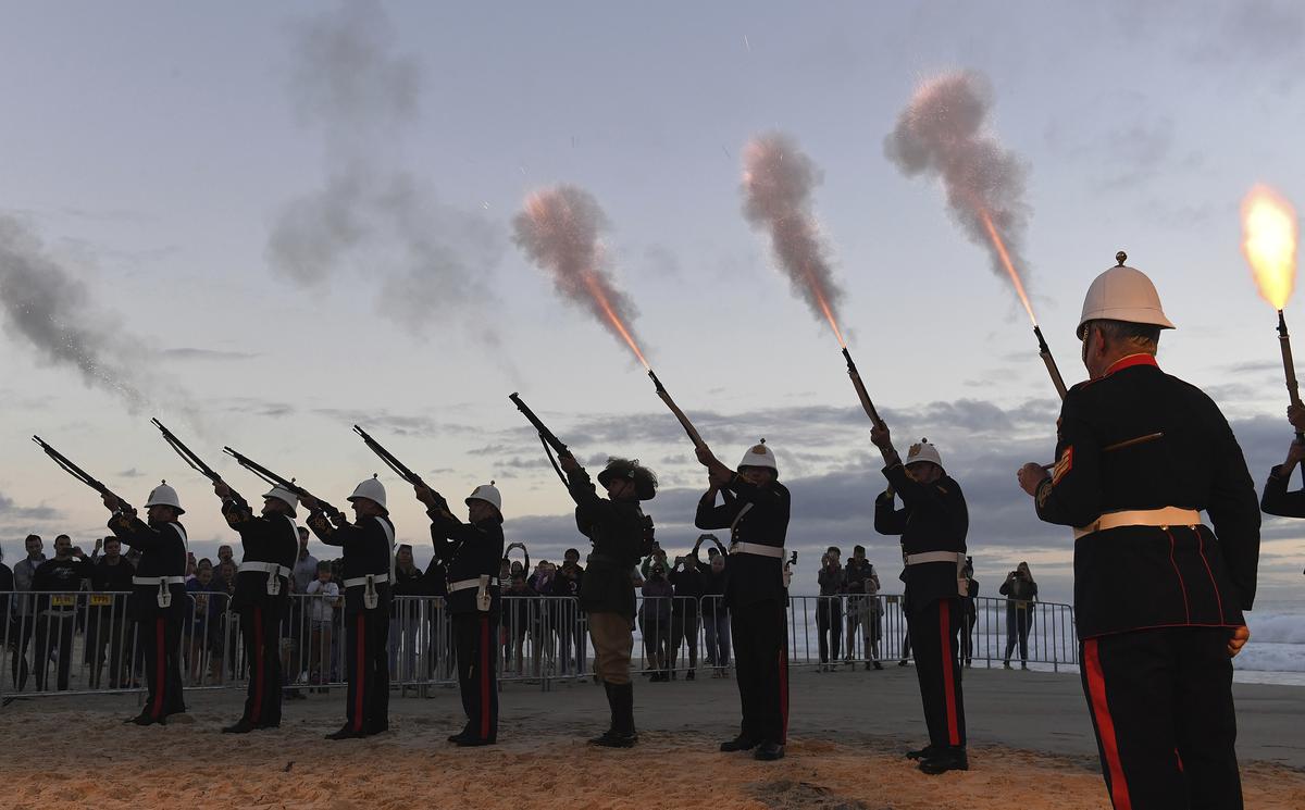 Australian military veterans fire into the air during the Anzac Day dawn service at Elephant Rock in Currumbin on the Gold Coast, Australia. Thousands of Australians gathered to commemorate the moment when Australian and New Zealand Army Corps troops waded ashore at the Gallipoli peninsula in Turkey 103 years ago in their first major battle of World War I. 