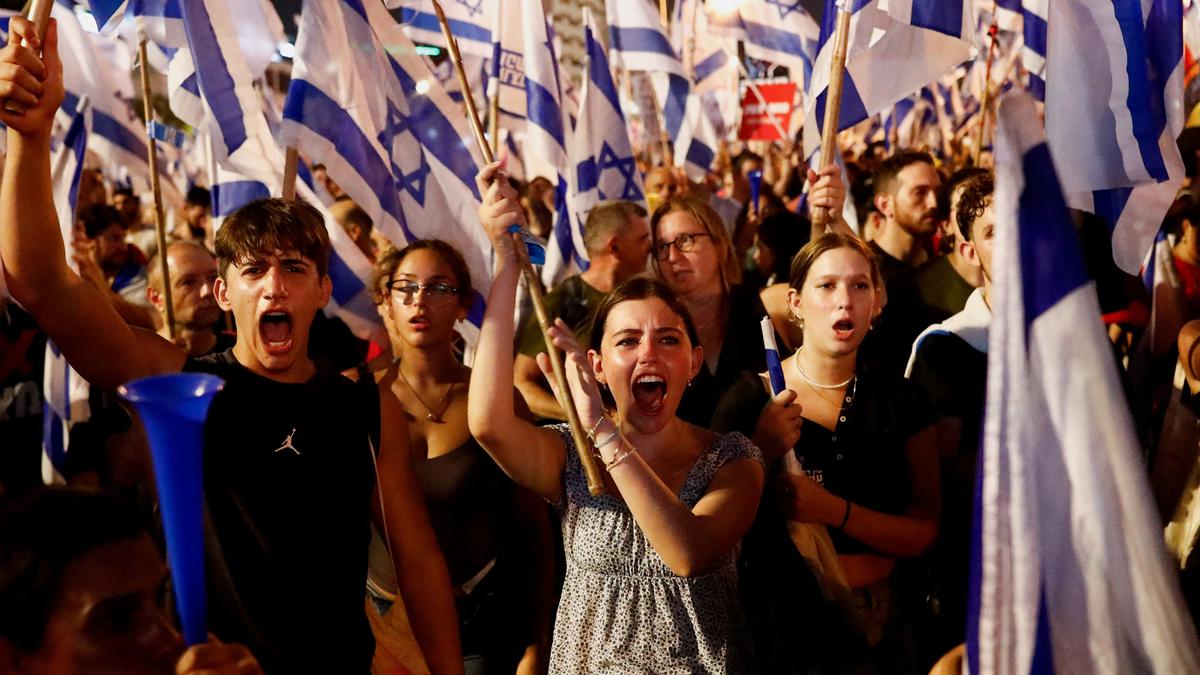 Israel's governing coalition presses ahead with plan to overhaul courts ahead of expected protests