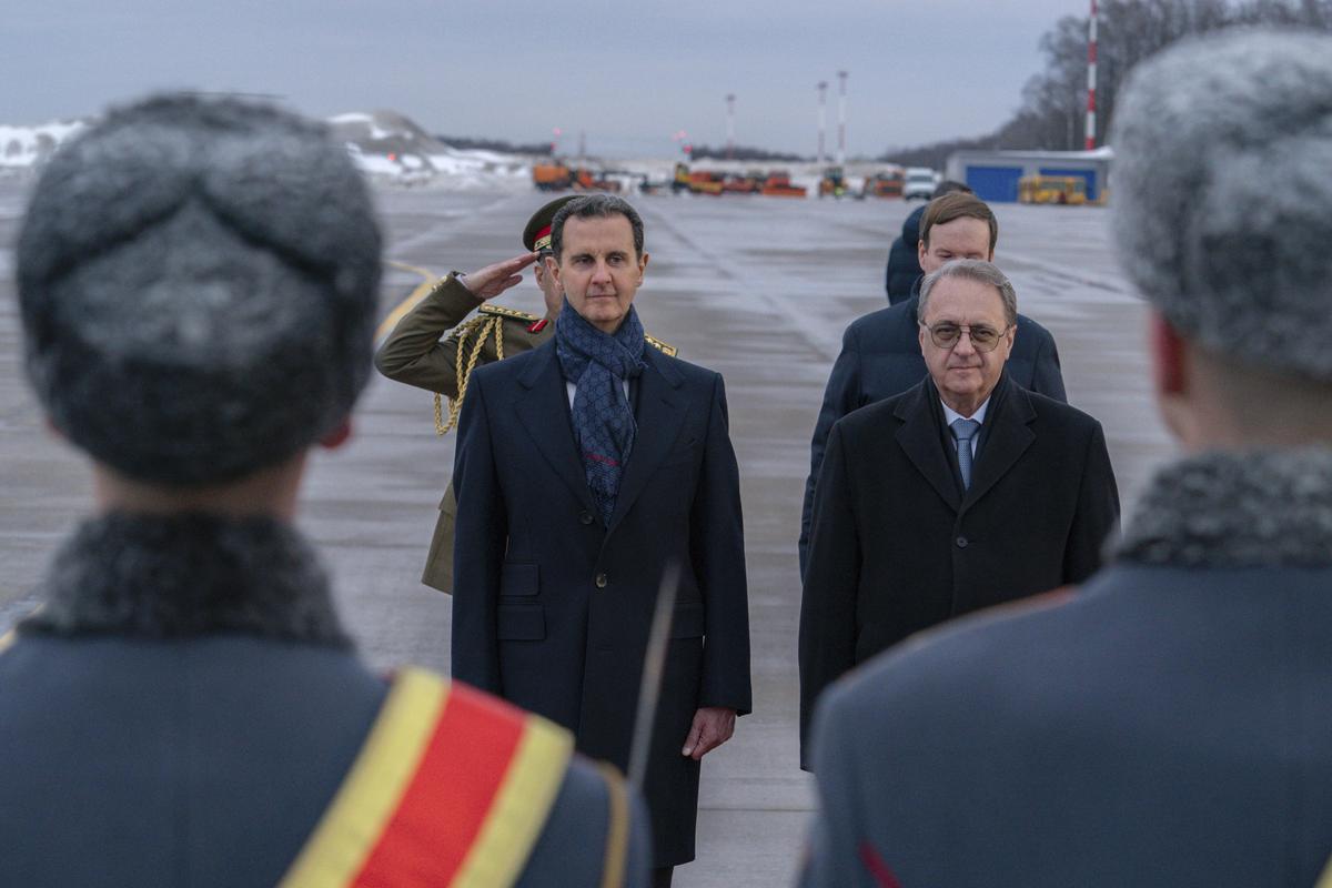 Syrian President Bashar Assad, left, and Mikhail Bogdanov, right, Deputy Minister of Foreign Affairs of Russia, review an honour guard during a welcome ceremony upon Assad’s arrival at Vnukovo airport in Moscow, Russia on March 14, 2023