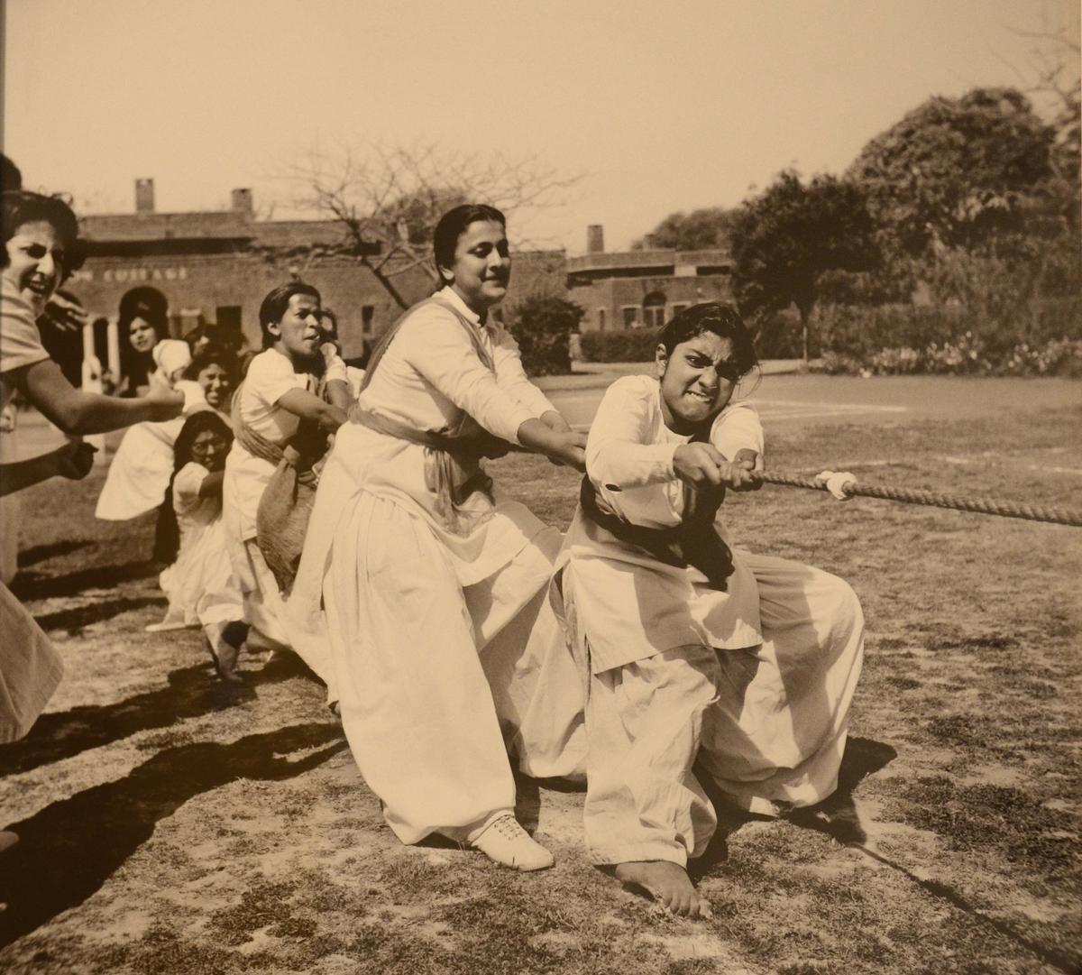 A photograph of ‘Women doing Tug of War’, taken by Homai Vyarawalla, on display at an exhibition in New Delhi on February 15, 2015. 