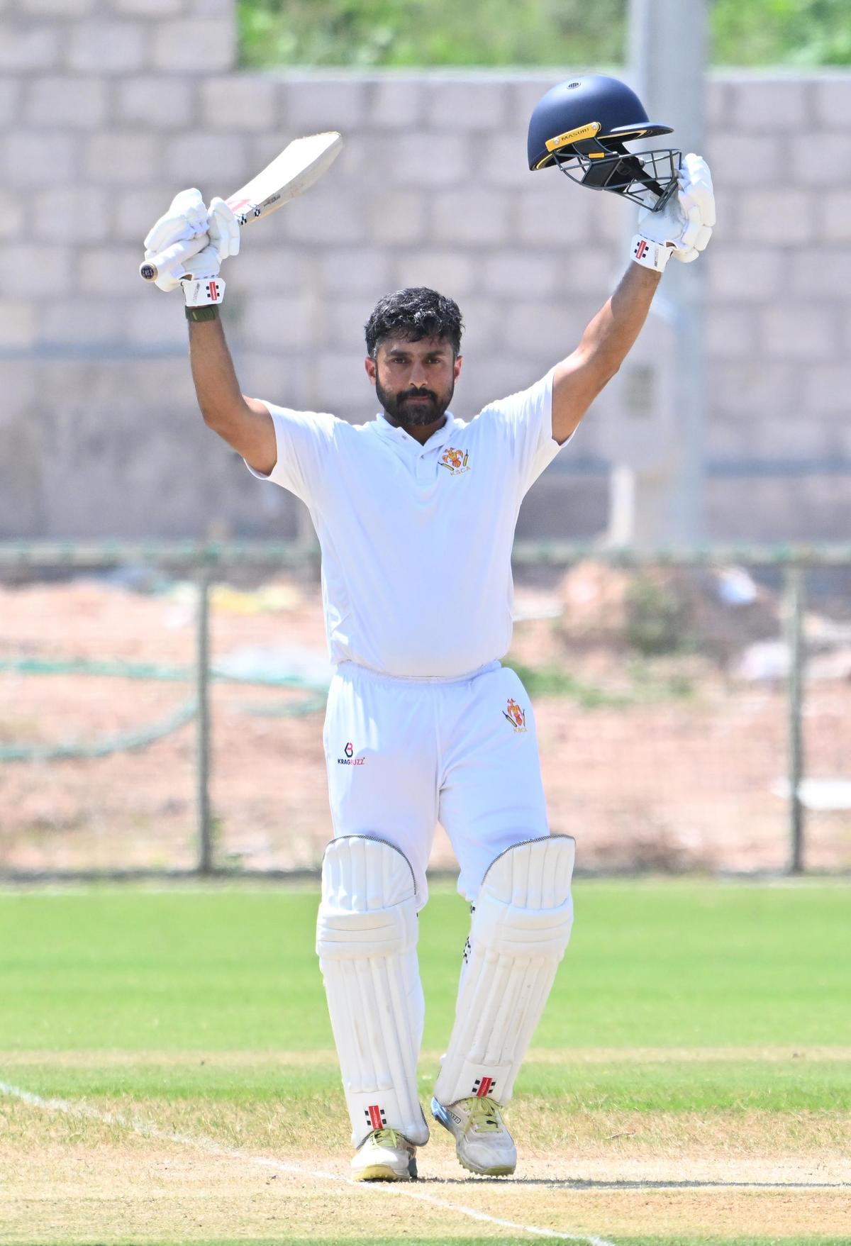 Karun celebrate his double century.