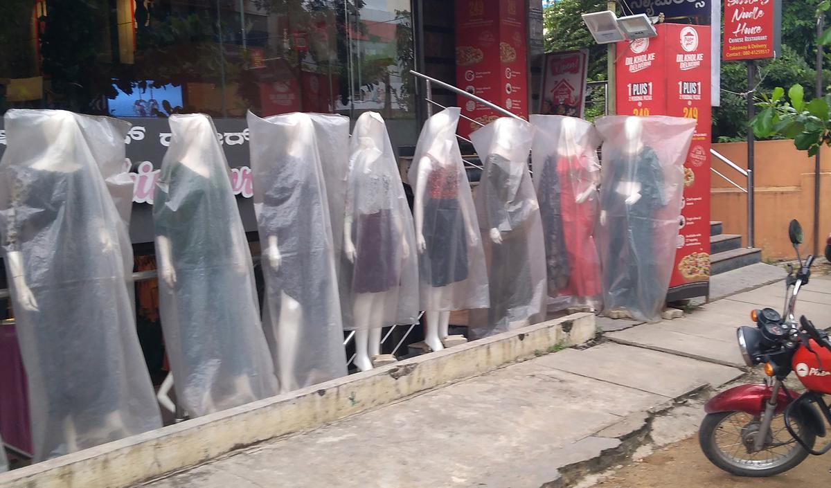 Mannequins with with plastic covers at a showroom in Bengaluru on July 19, 2022.