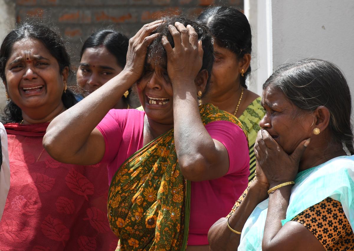 A relative of a deceased student grieves outside the Cuddalore District Government Hospital. 