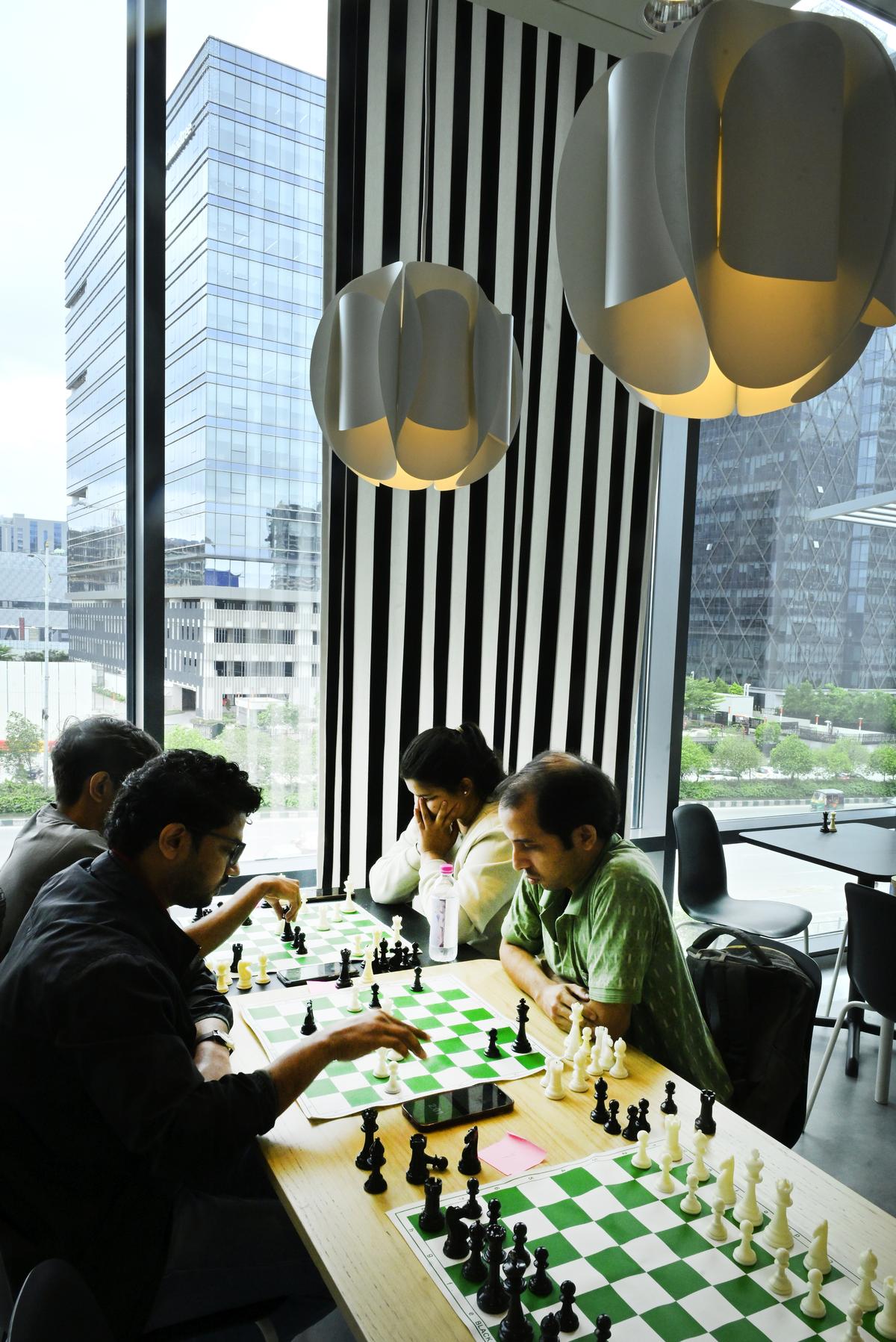 Chess enthusiasts gather at cafes over the weekends for friendly tournaments