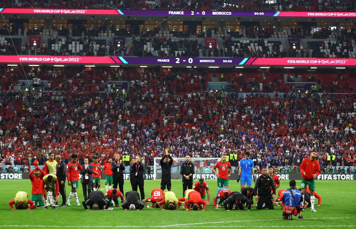 Morocco players bow down after their defeat to France at the FIFA World Cup Qatar 2022 semi-final at Al Bayt Stadium, Al Khor, Qatar.