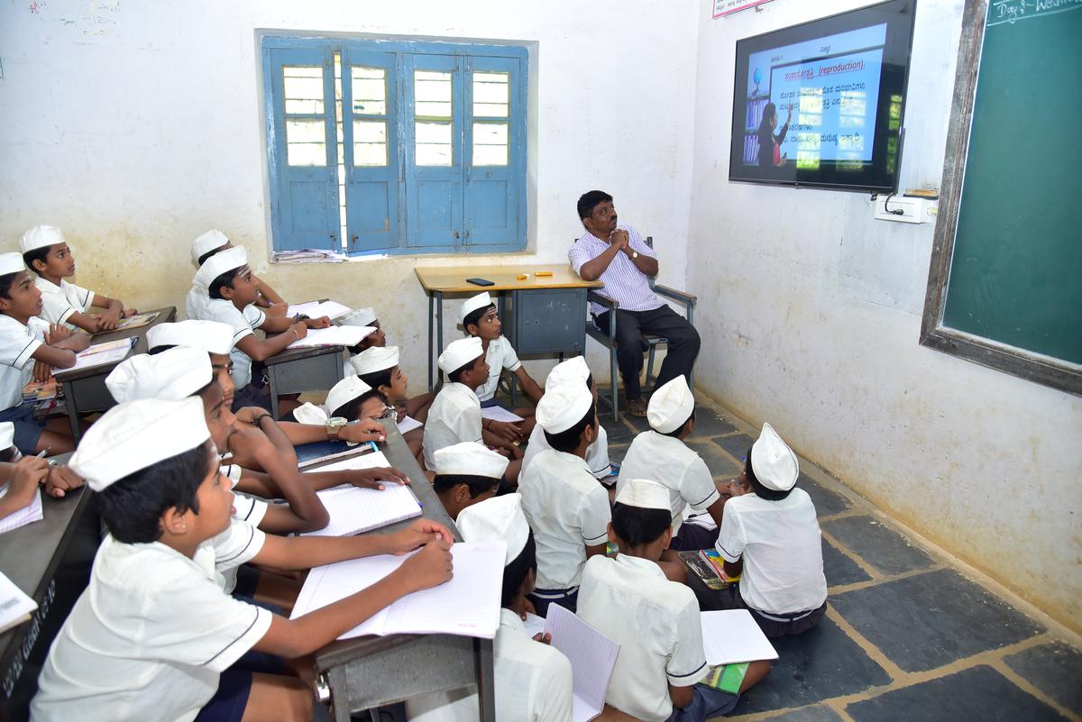 Students of Gandhi Grameen Gurukul Residential School listening to the lessons in a smart classroom.  