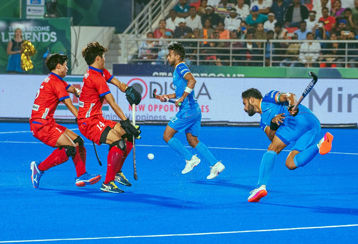 Players compete for the ball during the FIH Odisha Hockey Men's World Cup 2023 match between India and Japan, at the Bursa Munda Stadium in Rourkela. India secured the ninth position by defeating Japan.