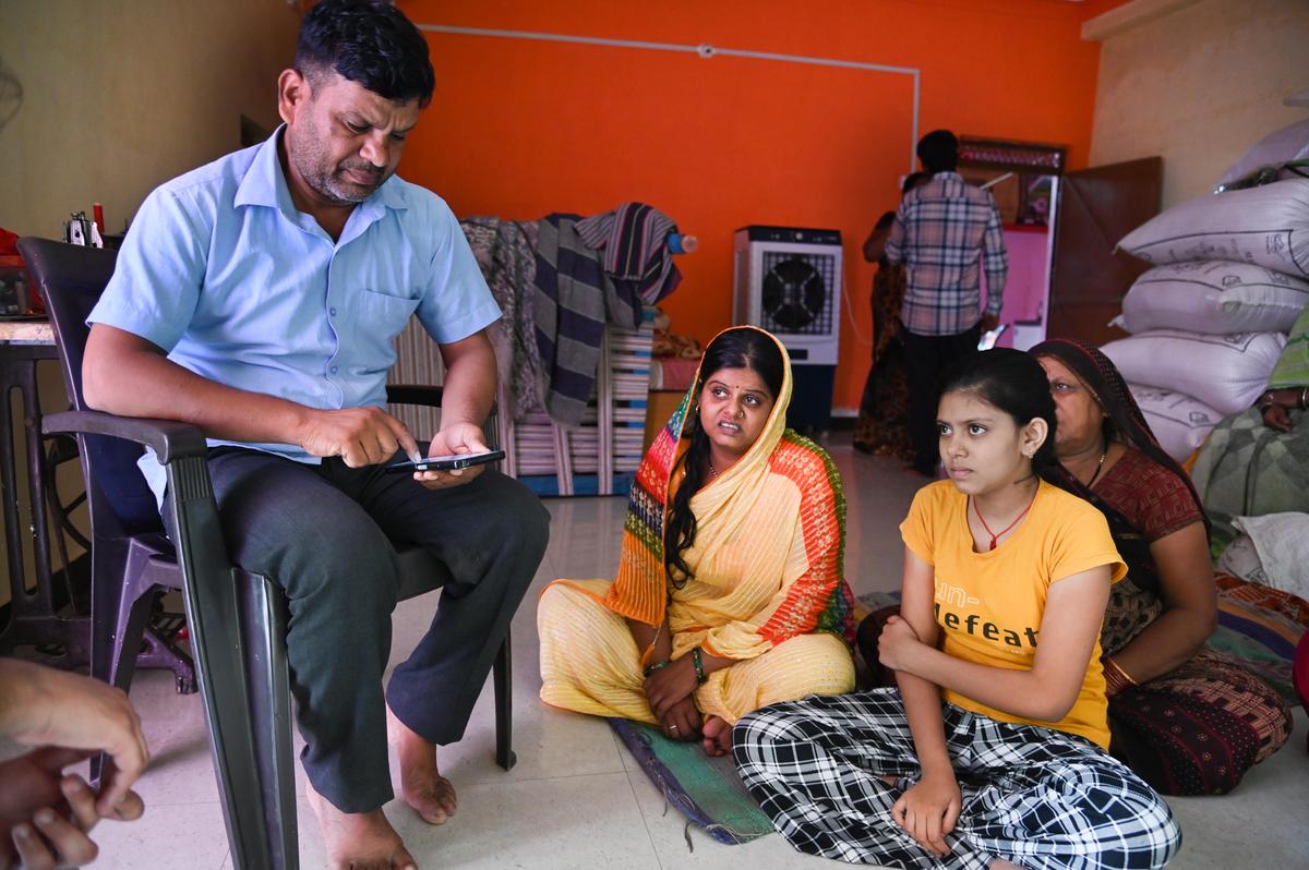 The parents, sister and relatives of Vansh Lodhi, 10, one of the children who died in the incident. 