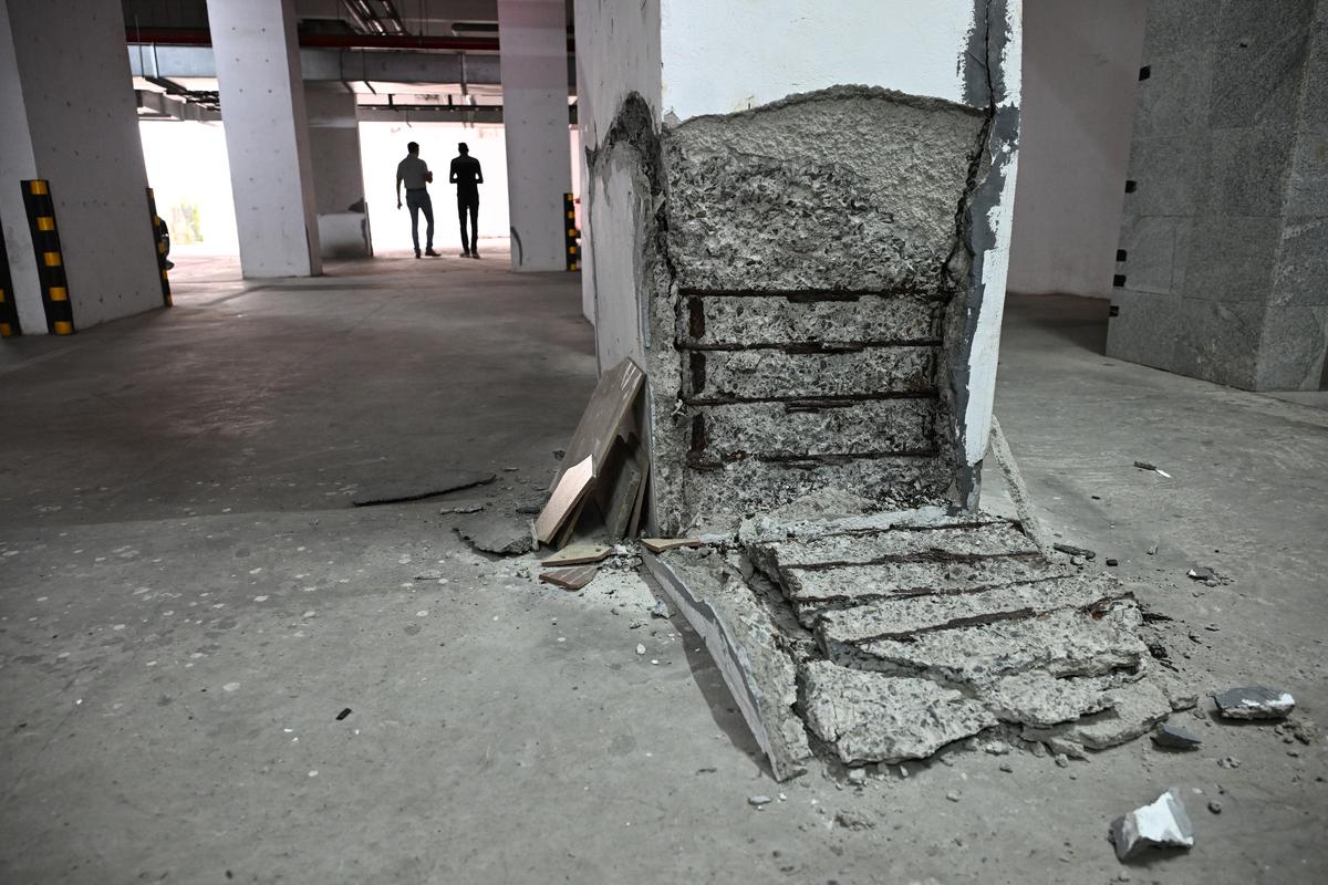 A foundation pillar stripped off concrete exposing the rusted reinforcing bars in the basement of one of the towers of Chander Kunj Army Towers in Vyttila, Kochi.