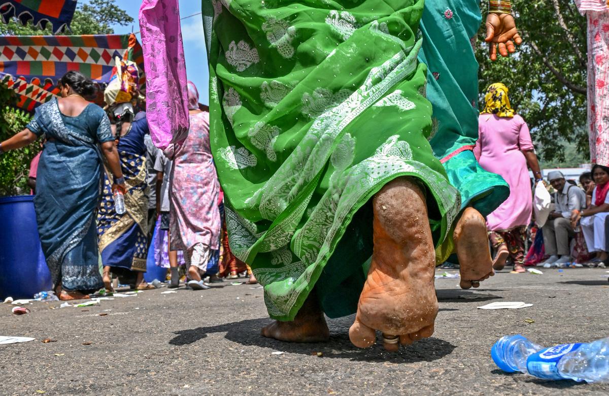 Devotees walking bare foot braving the hot sun, as they  participate in the annual ‘Giri Pradakshina’ of Sri Varaha Lakshmi Narasimha Swamy of Simhachalam Temple in Visakhapatnam on Wednesday.