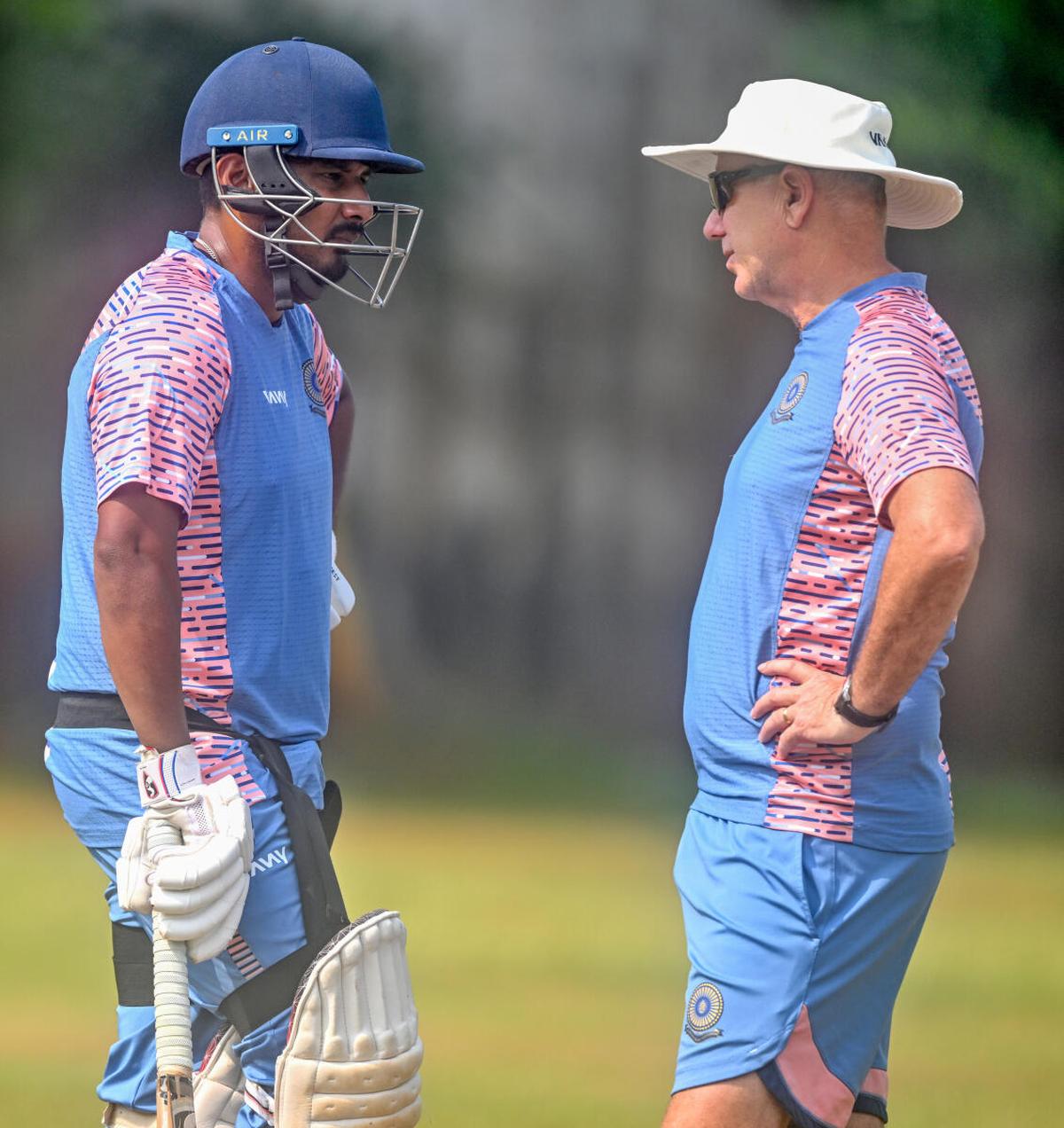 Andhra captain Ricky Bhui in conversation with head coach Gary Stead during a practice session.