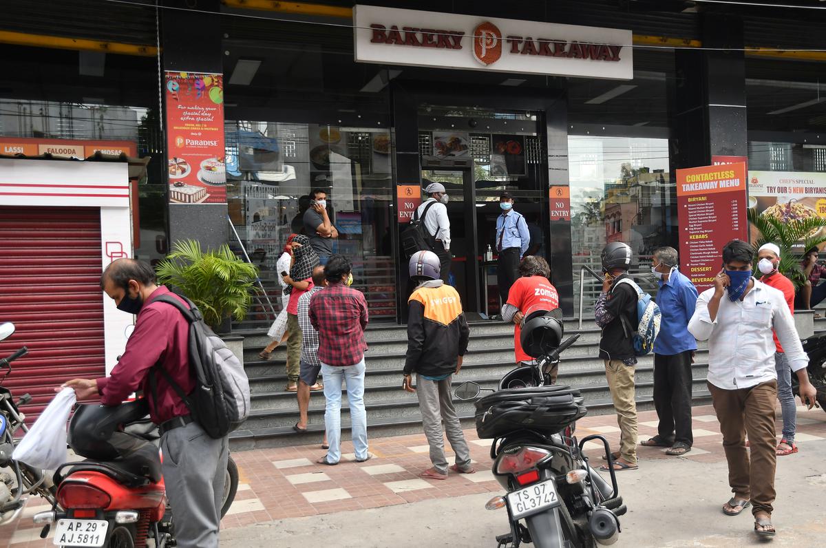 Biriyani lovers queue up at the counter of Paradise Bakery and Takeaway in Secunderabad. File 