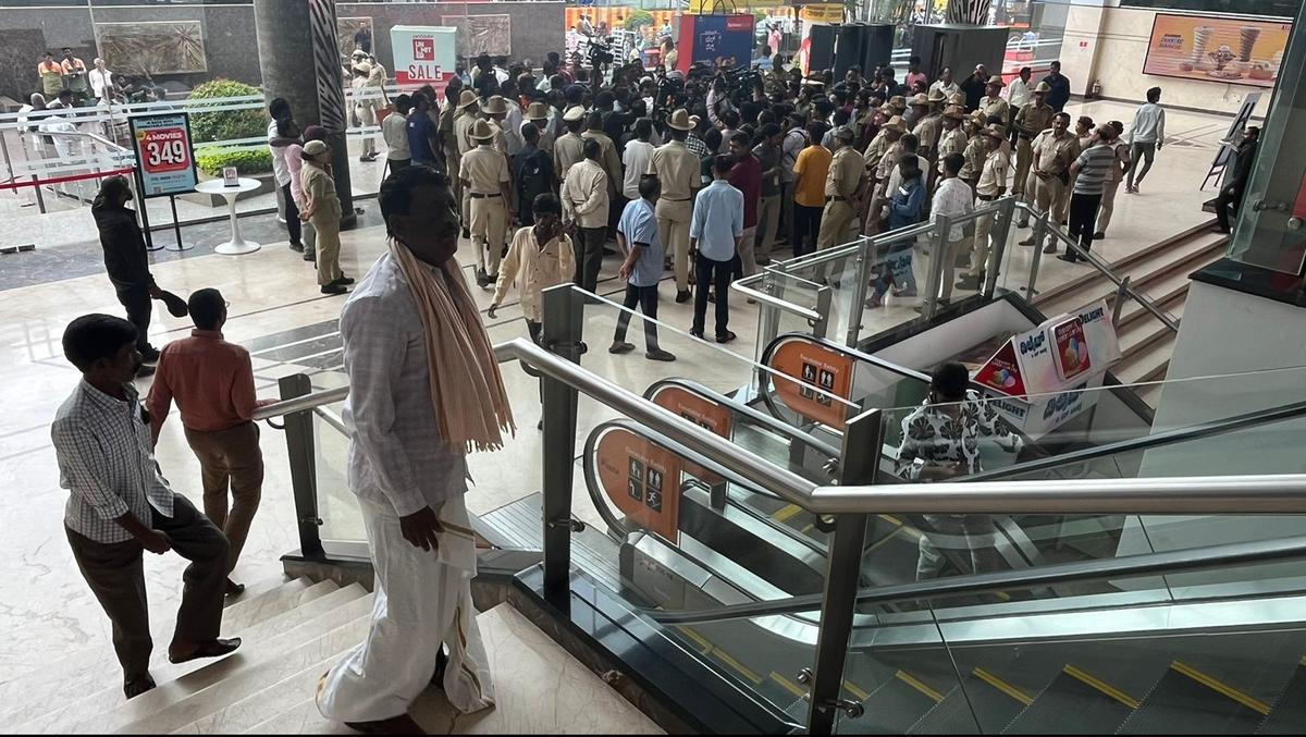 Police were posted at G.T. World Mall on Magadi Main Road in Bengaluru on July 17 after farmers demanded an apology from the management for denying entry to a farmer wearing a panche (dhoti) on July 16, 2024.