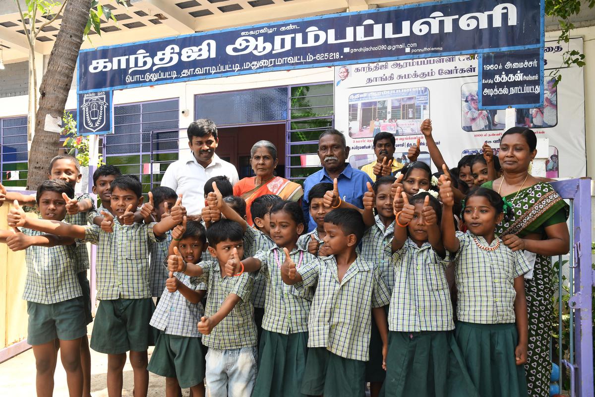 Nageswaran (in blue shirt) and the teachers of the school