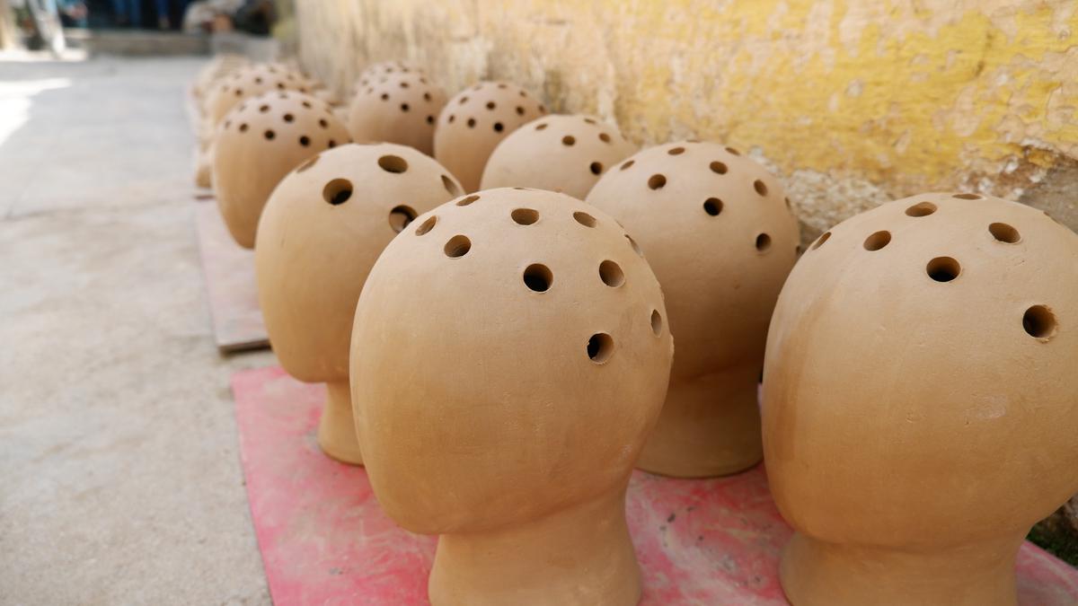 Head-shaped planters at Potter’s Town, Bengaluru 