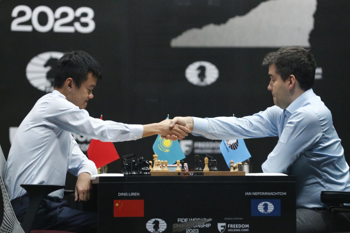 Russia’s Ian Nepomniachtchi, right, congratulates China’s winner Ding Liren during their tiebreaker of FIDE World Chess Championship in Astana, Kazakhstan, Sunday, April 30, 2023. China’s Ding Liren beat Russia’s Ian Nepomniachtchi in a thrilling finale. He takes over the world championship title from Norway’s Magnus Carlsen. 