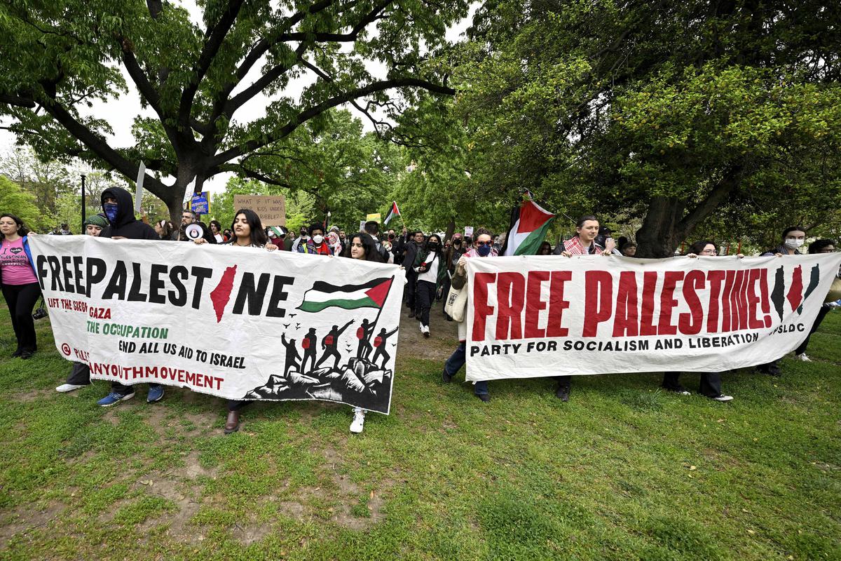 Demonstrators walk the streets during a pro-Palestinian protest over the Israel-Hamas war outside the White House Correspondents’ Association Dinner at the Washington Hilton, on April 27, 2024, in Washington. 
