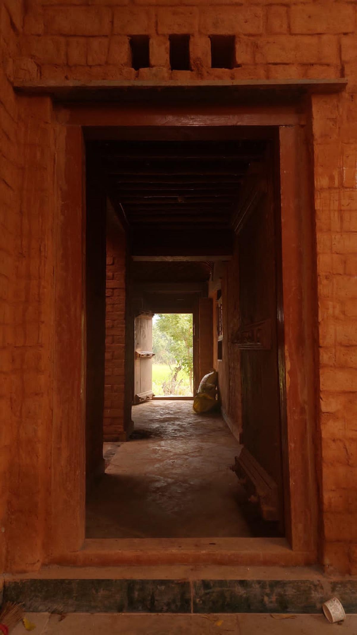 Rustic yet contemporary doorways at the Thalakudi house.