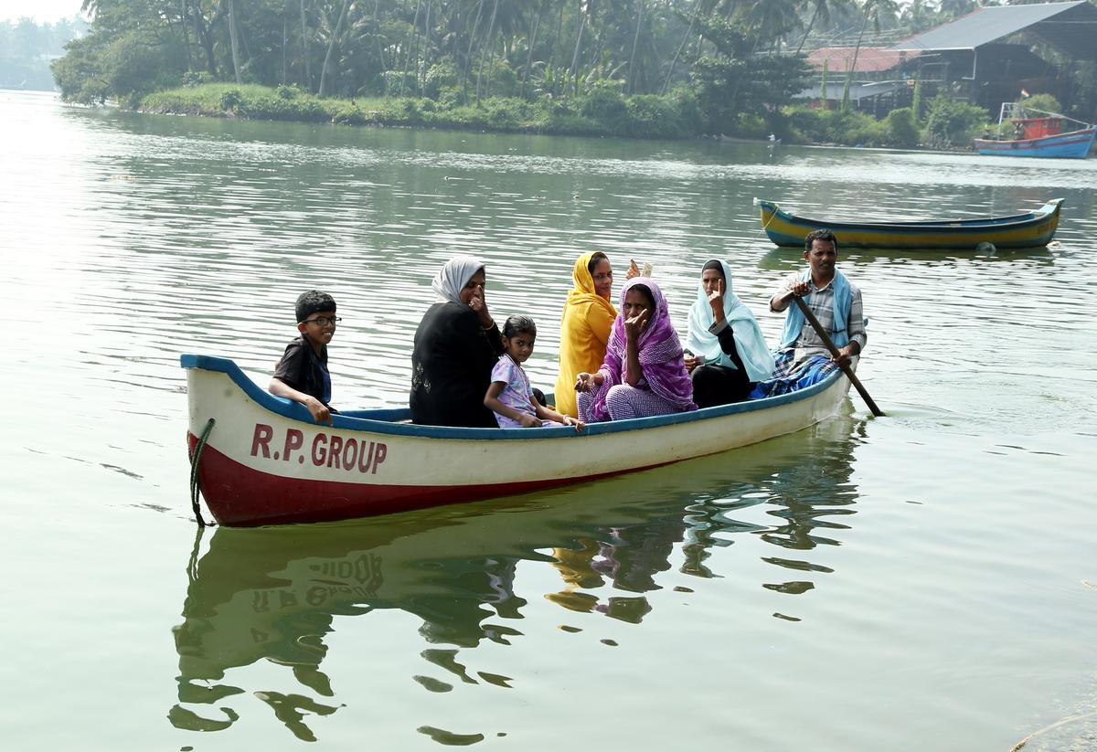 Voters from Kakkathuruthi, an islet near Chaliyam, Kozhikode, return to their homes in a country boat after casting their votes at Haji PBM English Medium School in Chaliyam. There are 10 voters in eight houses in Kakkathuruthi. 
