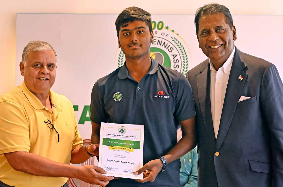 Ramesh Krishnan presents the T.K. Ramanathan award to Rethin Pranav as Vijay Amritraj, President, TNTA, looks on. Ramesh Krishnan presents the T.K. Ramanathan award to Rethin Pranav as Vijay Amritraj, President, TNTA, looks on.
