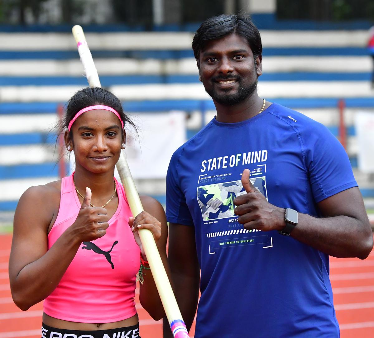 Coach and ward: Milber Bertrand Russell, right, with Rosy Meena.