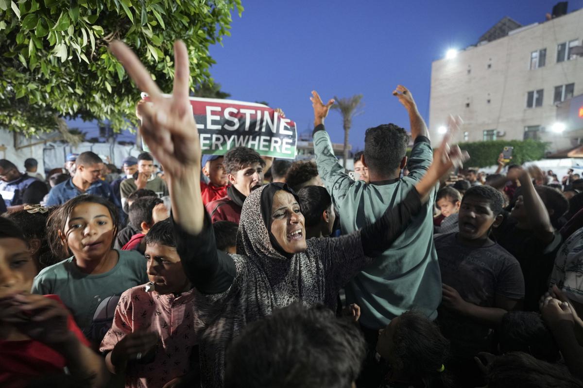 Palestinians celebrate in the streets following Hamas’s announcement that it accepted a ceasefire proposal in Deir al-Balah, Gaza Strip on May 6, 2024.