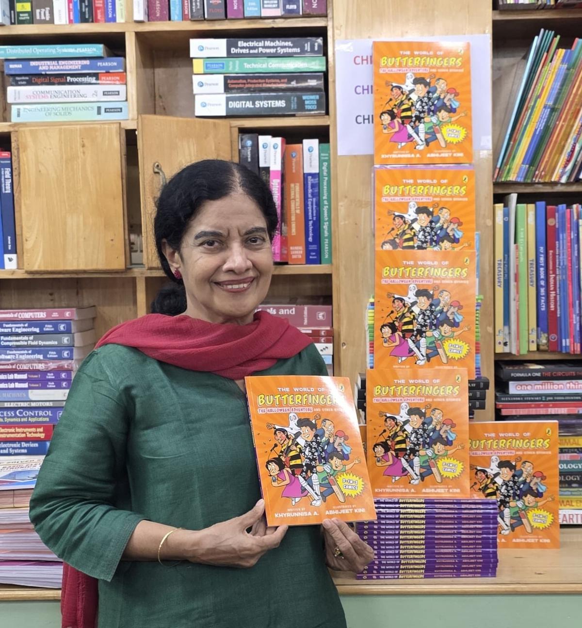Khyrunnisa A with her book, The World of Butterfingers : The Halloween Adventure And Other Stories Khyrunnisa A with her book, The World of Butterfingers : The Halloween Adventure And Other Stories