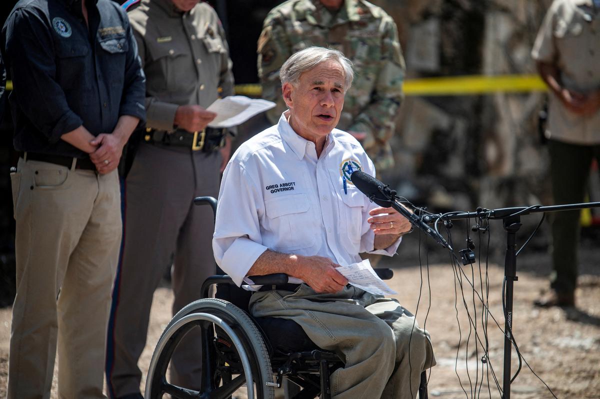 Texas Governor Greg Abbott speaks to the media at a press conference in the aftermath of deadly flooding