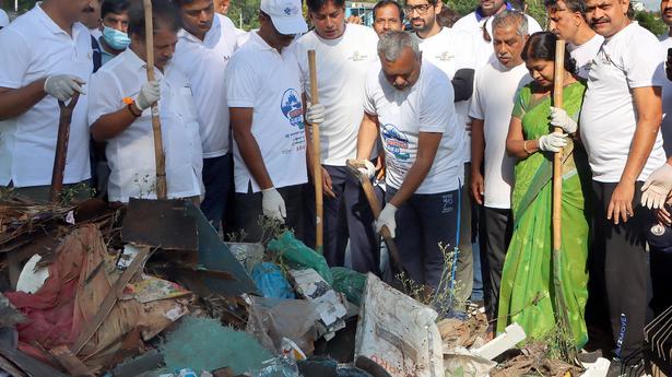 Minister, Mayor wield the broom