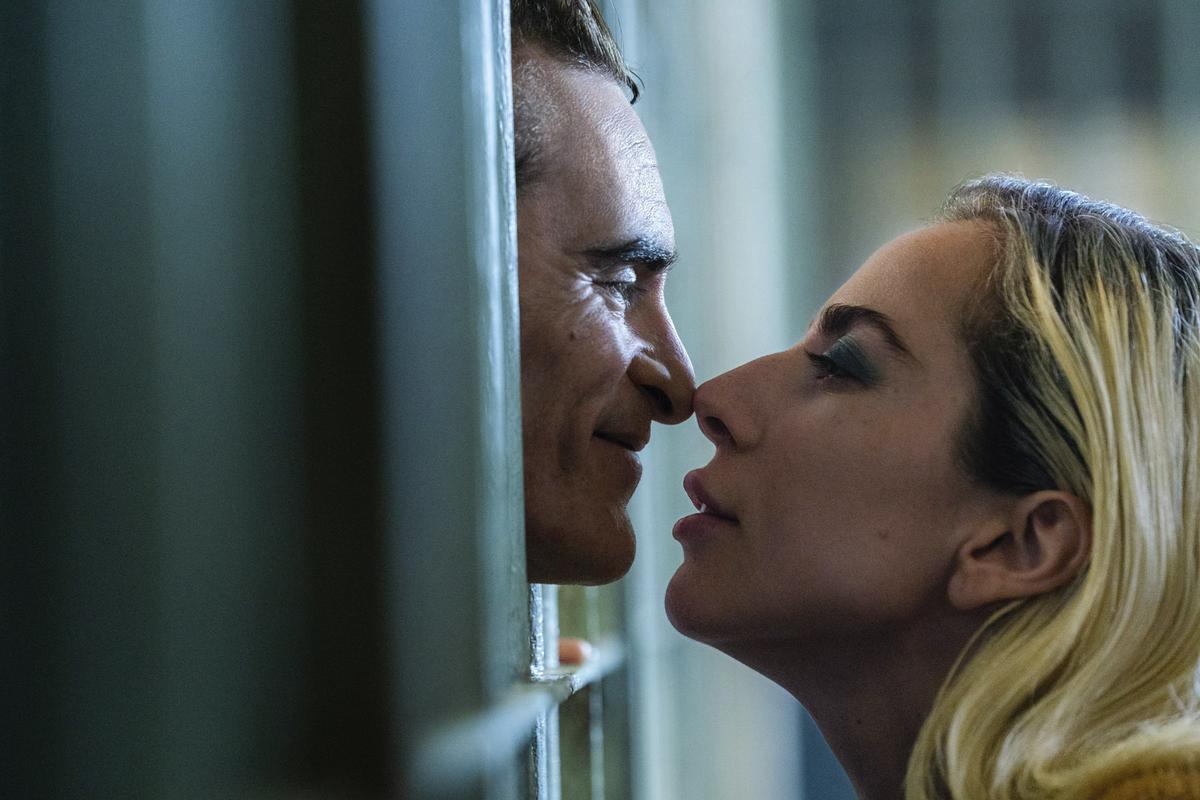 This image released by Warner Bros.  Pictures shows Joaquin Phoenix, left, and Lady Gaga in a scene from 'Joker: Folie à Deux'