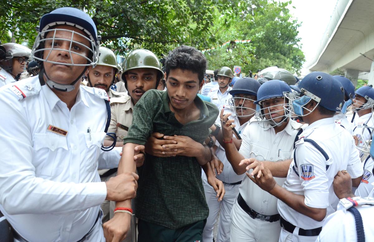 Police detain Students Federation of India (SFI) activists took part in a protest rally against State Government Bhawan during their march to Bikash Bhawan over merit list for admission to college after higher secondary is not out yet and the results of the Joint Entrance Examination are not out issue, at Salt Lake in Kolkata on Aug 19, 2025. 