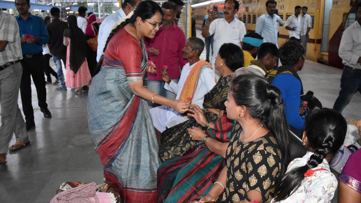 Reaching out to voters at railway and bus stations with roses