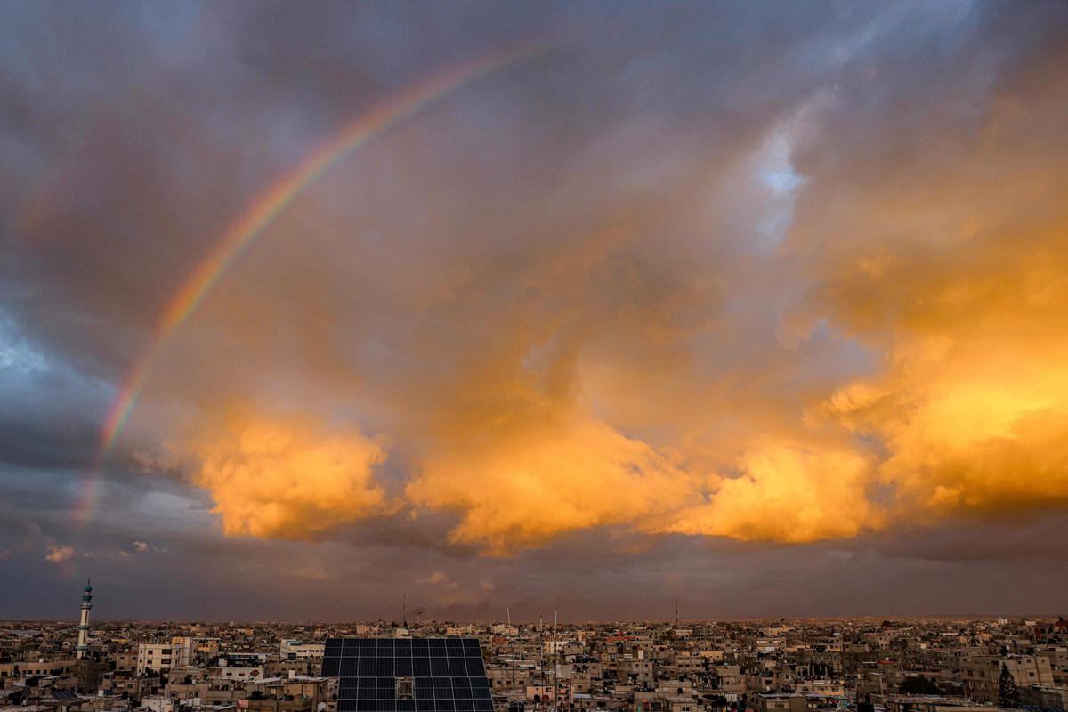 A picture taken from Rafah shows a rainbow over the southern Gaza Strip on January 11, 2024, amid ongoing battles between Israel and Palestinian Hamas militants in the Gaza Strip. A picture taken from Rafah shows a rainbow over the southern Gaza Strip on January 11, 2024, amid ongoing battles between Israel and Palestinian Hamas militants in the Gaza Strip.
