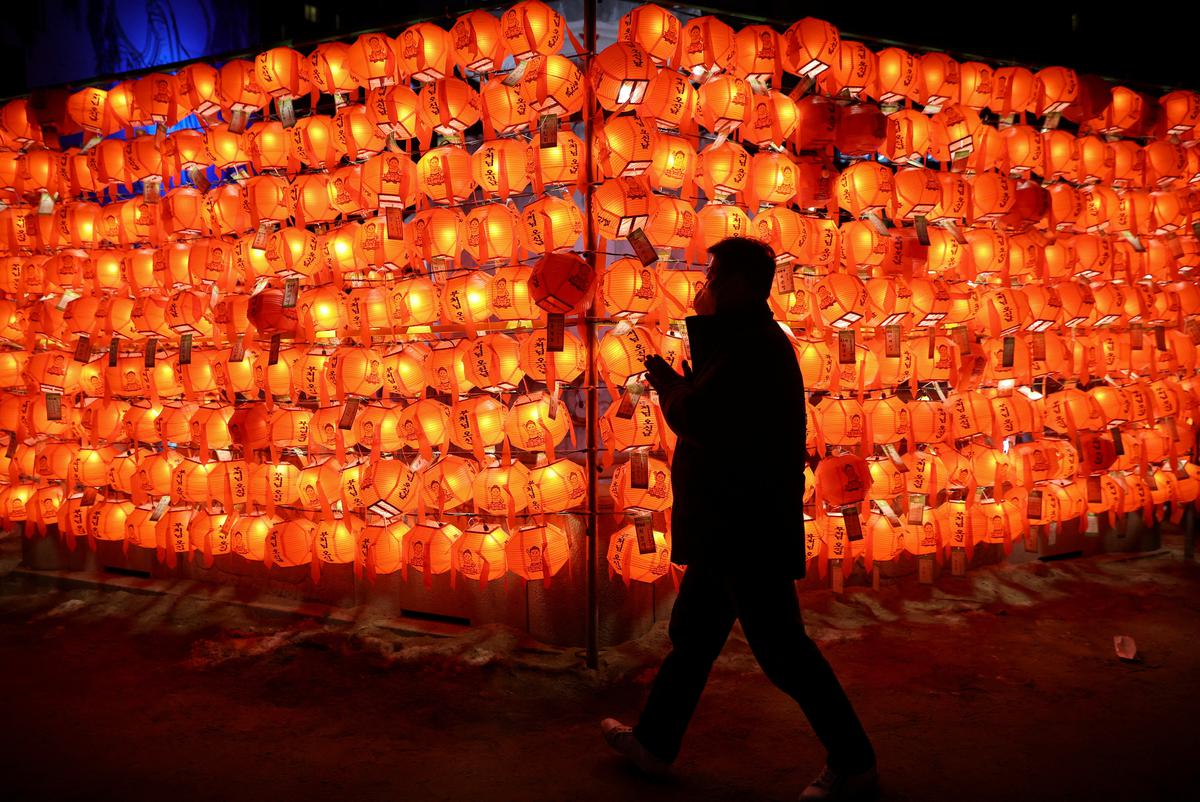 A person walks in a Buddhist temple during New Year’s Eve celebrations in Seoul, South Korea on January 1, 2023. 